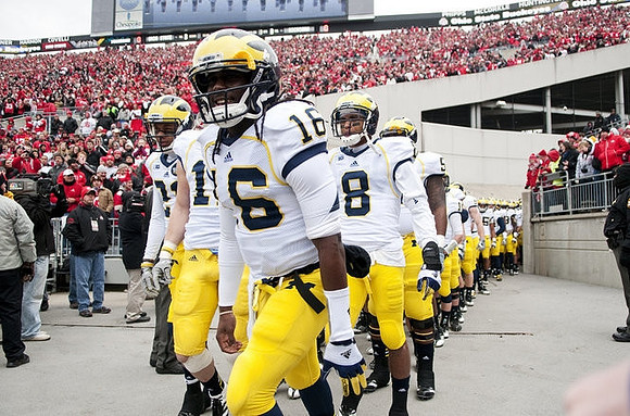 Denard Robinson (16) and J.T. Floyd (8)