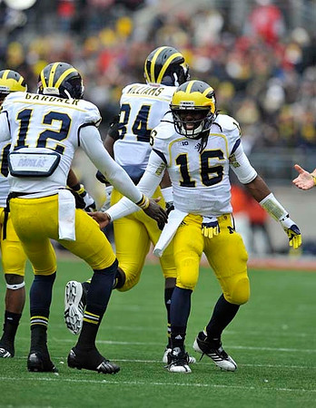 Devin Gardner (12), Denard Robinson (16), and A.J. Williams (84)