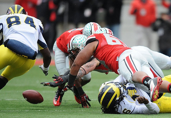 A.J. Williams (84) and Denard Robinson (16)