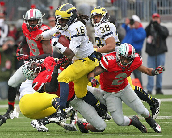 Denard Robinson (16) and Thomas Rawls (38)