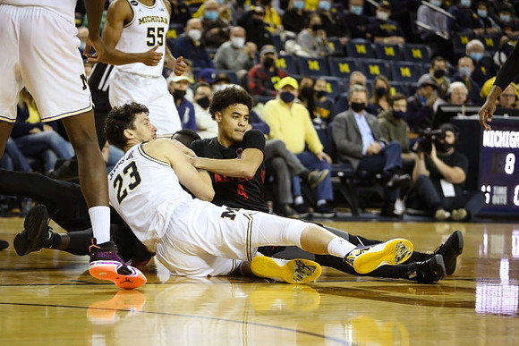 Eli Brooks (55) and Brandon Johns Jr. (23)