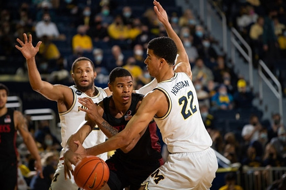 DeVante' Jones (12) and Caleb Houstan (22)