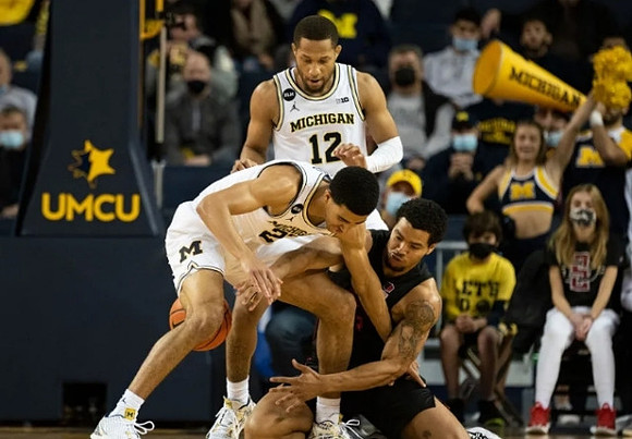 Caleb Houstan (22) and DeVante' Jones (12)
