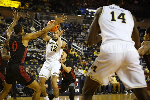DeVante' Jones (12) and Moussa Diabate (14)