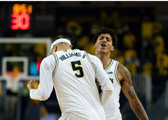 Terrance Williams II (5) and Eli Brooks (55)