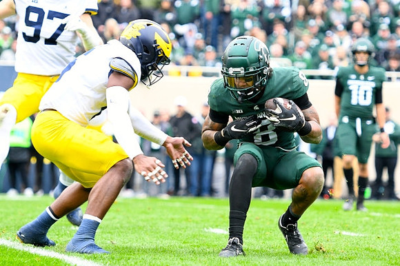 Aidan Hutchinson (97) and R.J. Moten (6)
