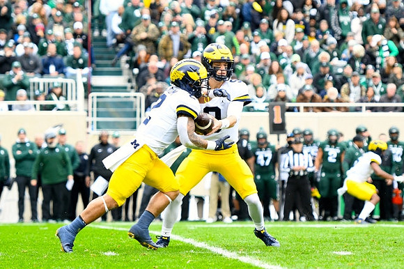 Blake Corum (2) and J.J. McCarthy (9)