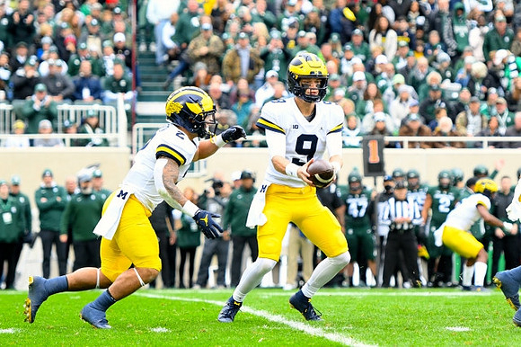 Blake Corum (2) and J.J. McCarthy (9)