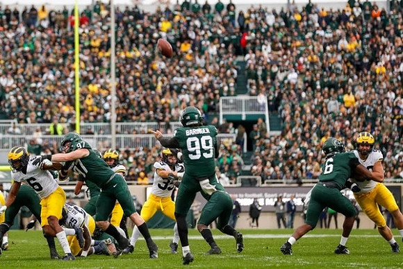 Cornelius Johnson (6), Hassan Haskins (25), and Caden Kolesar (35)