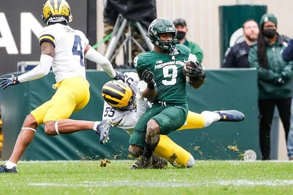 Vincent Gray (4) and David Ojabo (55)