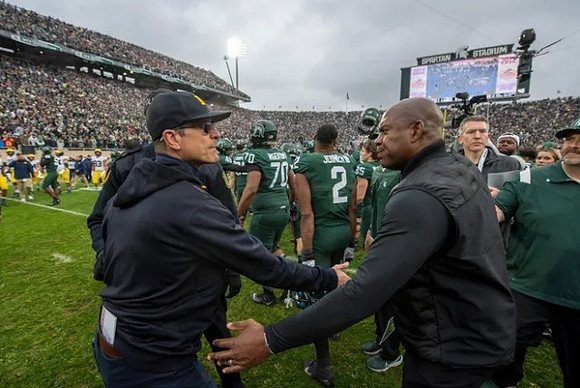 Jim Harbaugh and Michigan State Head Coach Mel Tucker