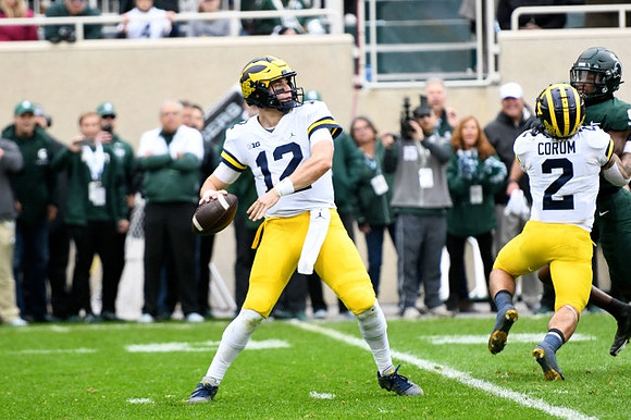 Cade McNamara (12) and Blake Corum (2)