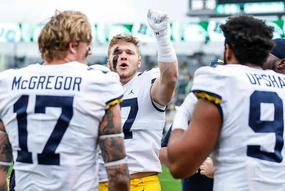 Braiden McGregor (17), Aidan Hutchinson (97), and Taylor Upshaw (91)