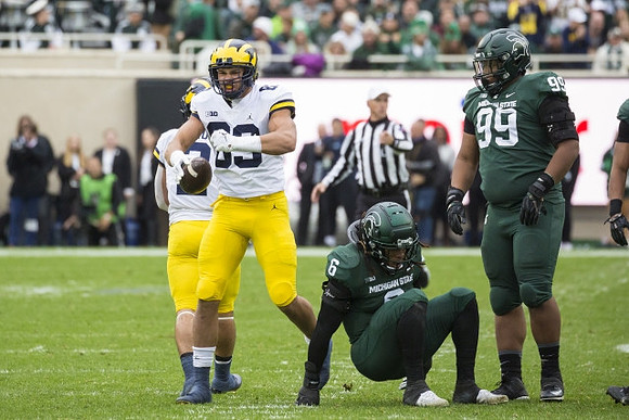 Blake Corum (2) and Erick All (83)