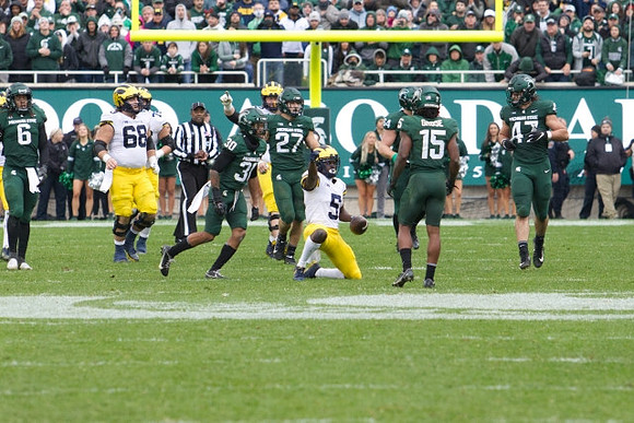 Andrew Vastardis (68) and Mike Sainristil (5)