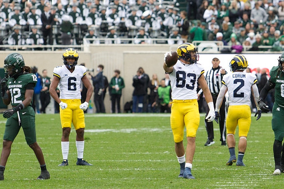 Cornelius Johnson (6), Erick All (83), and Blake Corum (2)