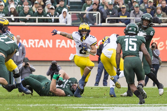 Blake Corum (2) and Erick All (83)