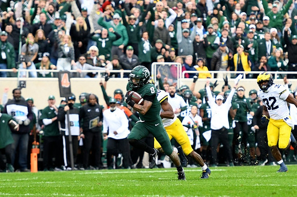 Daxton Hill (30) and Jaylen Harrell (32)