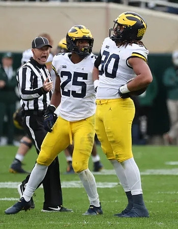 Junior Colson (25) and Mike Morris (90)