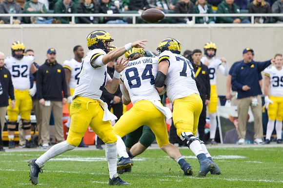 Cade McNamara (12), Joel Honigford (84), and Griffin Korican (78)