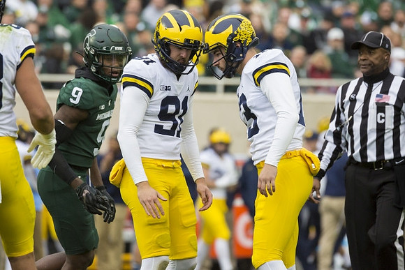 Brad Robbins (91) and Jake Moody (13)