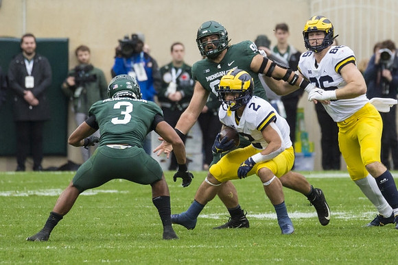 Blake Corum (2) and Luke Schoonmaker (86)