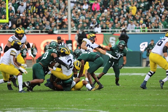 Karsen Barnhart (52), Blake Corum (2), and Luke Schoonmaker (86)