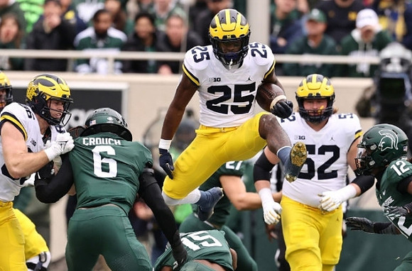 Luke Schoonmaker (86), Hassan Haskins (25), and Karsen Barnhart (52)