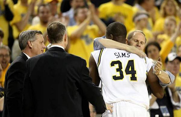 DeShawn Sims (34) and John Beilein