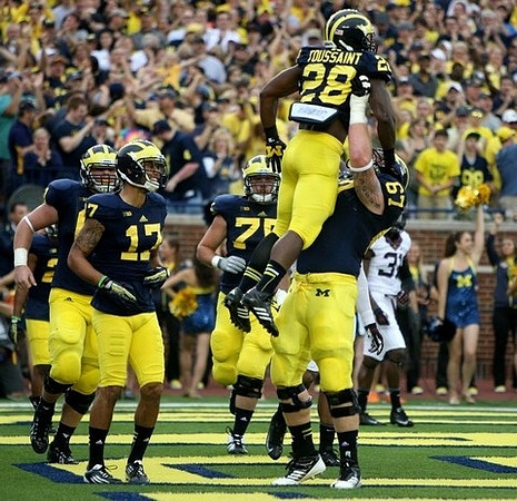 Jeremy Jackson (17), Michael Schofield (75), Fitzgerald Toussaint (28), and Kyle Kalis (67)