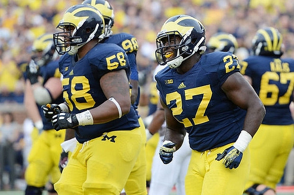 Chris Bryant (58), Devin Gardner (98), Derrick Green (27), and Kyle Kalis (67)