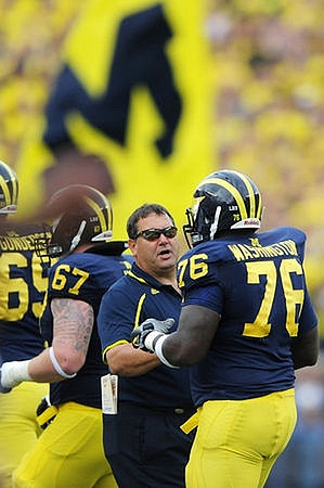 Erik Gunderson (69), Kyle Kalis (67), Brady Hoke, and Quinton Washington (76)