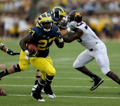 Derrick Green (27) and Michael Schofield (75)