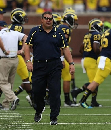 Jarrod Wilson (22), Brady Hoke, Jareth Glanda (54), Dennis Norfleet (23), and James Ross (15)