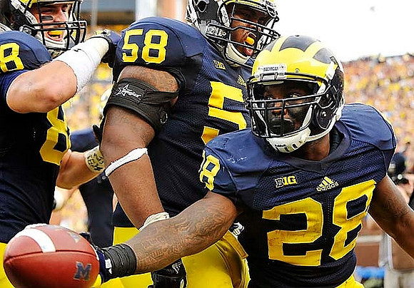Jake Butt (88), Chris Bryant (58), and Fitzgerald Toussaint (28)