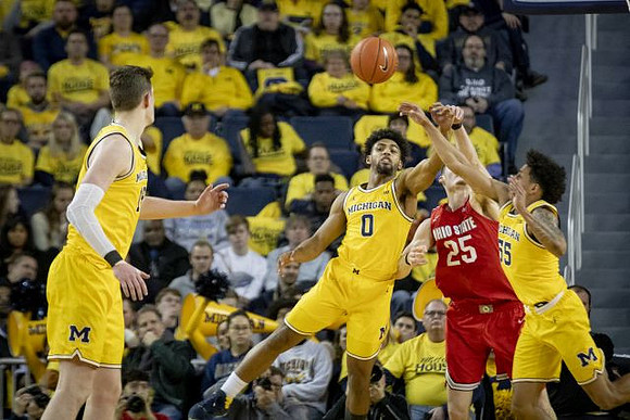 Jon Teske (15), David DeJulius (0), and Eli Brooks (55)