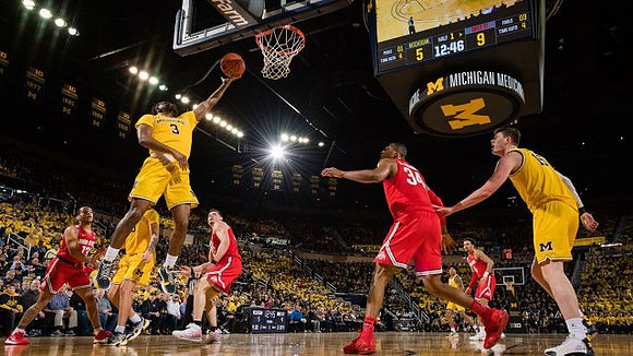 Zavier Simpson (3), Eli Brooks (55), and Jon Teske (15)