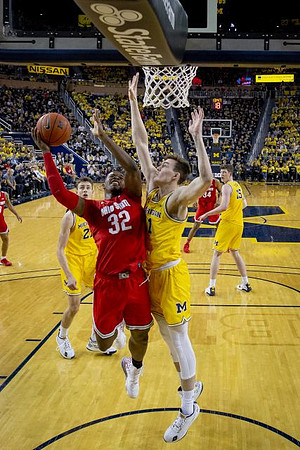 Franz Wagner (21), Colin Castleton (11), and Jon Teske (15)
