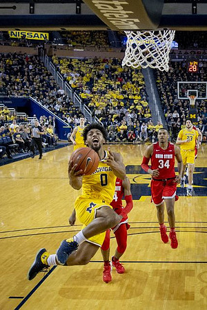 David DeJulius (0), Franz Wagner (21), and Brandon Johns Jr. (23)