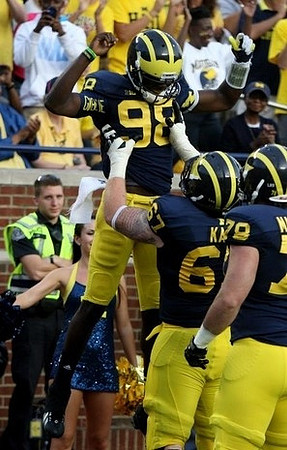 Devin Gardner (98), Kyle Kalis (67), and Erik Magnuson (78)