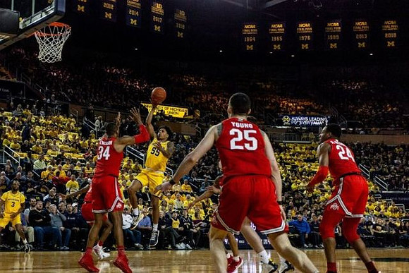 Zavier Simpson (3) and Eli Brooks (55)