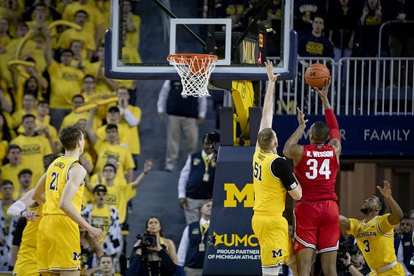 Franz Wagner (21), Austin Davis (51), and Zavier Simpson (3)