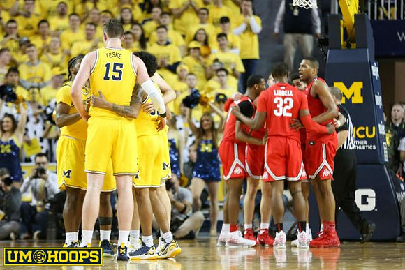 Zavier Simpson (3), Jon Teske (15), and Eli Brooks (55)