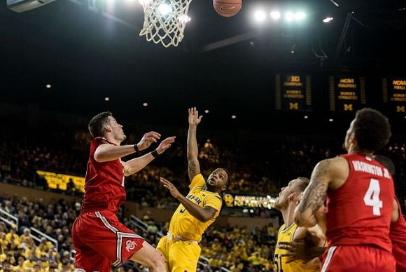 Zavier Simpson (3) and Austin Davis (51)