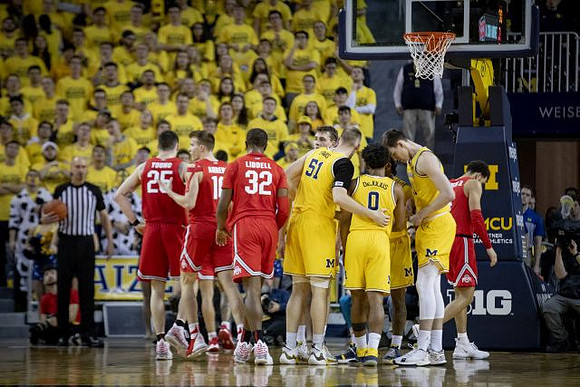 Franz Wagner (21), Austin Davis (51), David DeJulius (0), Zavier Simpson (3), and Colin Castleton (11)