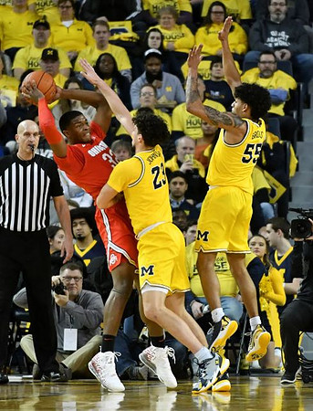 Brandon Johns Jr. (23) and Eli Brooks (55)