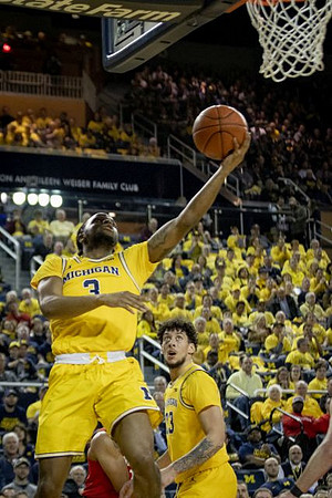 Zavier Simpson (3) and Brandon Johns Jr. (23)