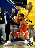 Brandon Johns Jr. (23) and Zavier Simpson (3)
