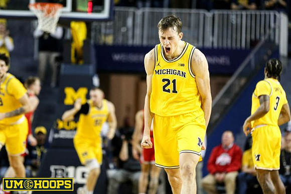 Brandon Johns Jr. (23), Austin Davis (51), Franz Wagner (21), and Zavier Simpson (3)