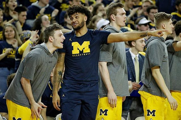 Luke Wilson (32), Isaiah Livers (2), Jaron Faulds (44), and Cole Bajema (22)
